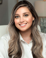 female therapist up close headshot while sitting at her desk in the office